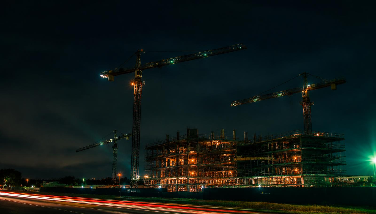 Construction tower cranes working at night